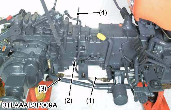 Remove the brake rod (1) (R.H), (L.H). 2. Remove the suction pipe (3). 3. Disconnect the PTO safety switch connectors (2). 4. Remove the front wheel drive lever (4).