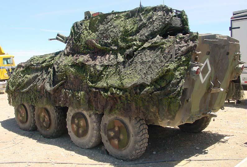 Finally pieces of the 2 camouflage nets, the LCSS and ULCANS were draped over the vehicle. Figure 10 and 11.