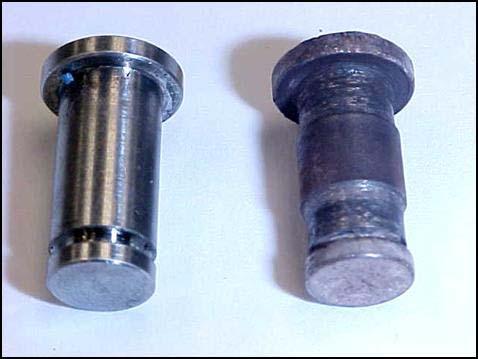 In Figure 6, the pin on the right, from the dirty turbocharger shown in Figure 5 is compared to a new pin. Figure 5. Dirty Turbocharger Figure 6.