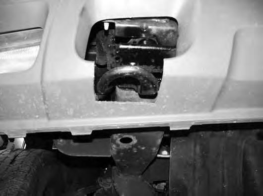 70. Secure tow hooks with stock hardware through the original frame mount holes and new bumper relocation brackets. Torque bolt to 60 ft-lbs. 71.