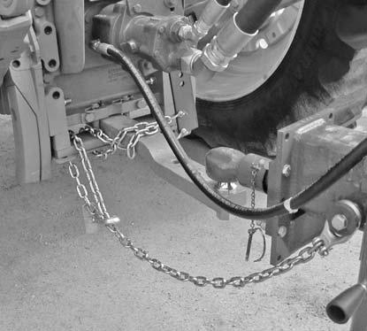 4. Connect hitch to tractor ball and drawbar safety chain to tractor.