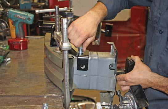 Using the side mounting point of the main receiver brace as a template, drill a ½" hole through the side of the bumper core (Fig.U).