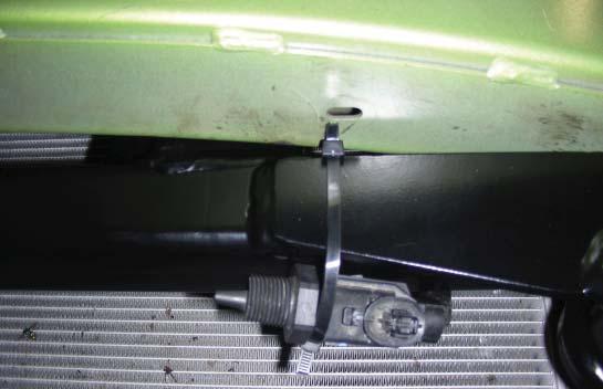 Replace and tighten the core support bolts, making certain that the core support seats correctly by aligning it with the