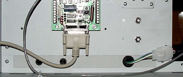 9. Disconnect the white 4 pin connector from the DIN barrier strip rail on the