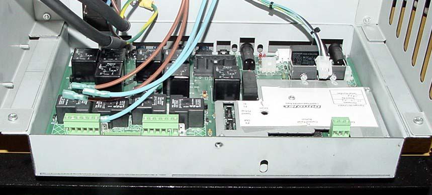 14. Slide the Control Panel Interface board assembly into the rear