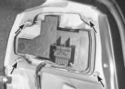 17 On Saloon and Hatchback models, remove the screws, release the clips, and remove the trim panel from the rear cross panel. On Estate models, it is sufficient to open the flap.