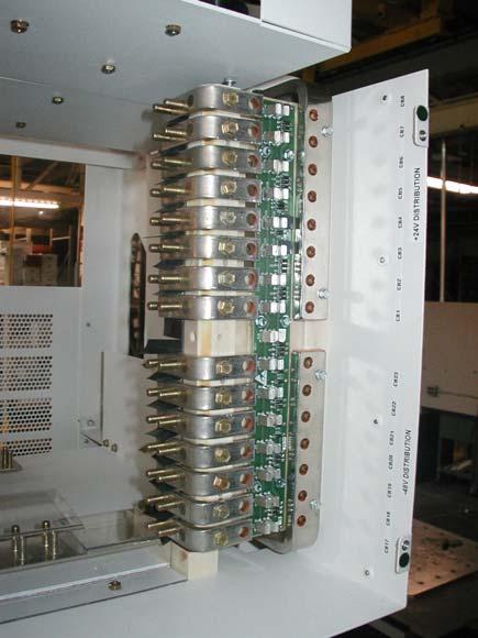 Connect the 48VDC load(s) to the individual circuit breaker bus bars (from circuit breakers CB1 thru CB24, as required) from the front of the display and control module.