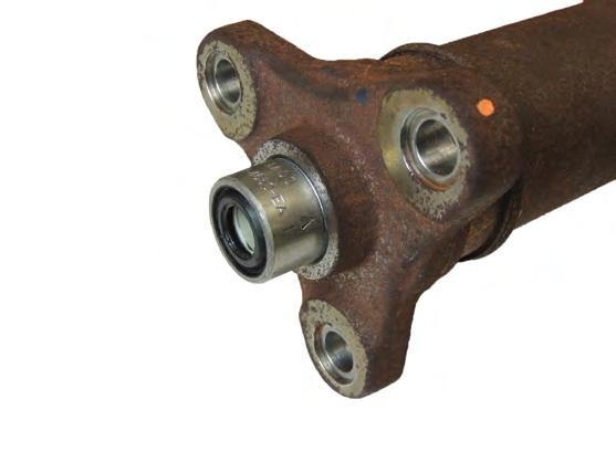 NOTE: When installing the driveshaft safety strap bolts, the bolts must be threaded in by hand as far as possible before using hand or power tools.