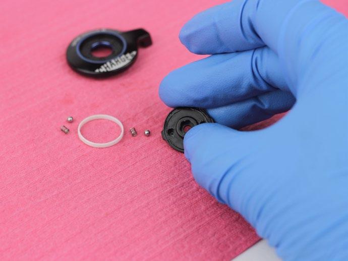 Use a pick to remove the glide ring, springs, and detent balls