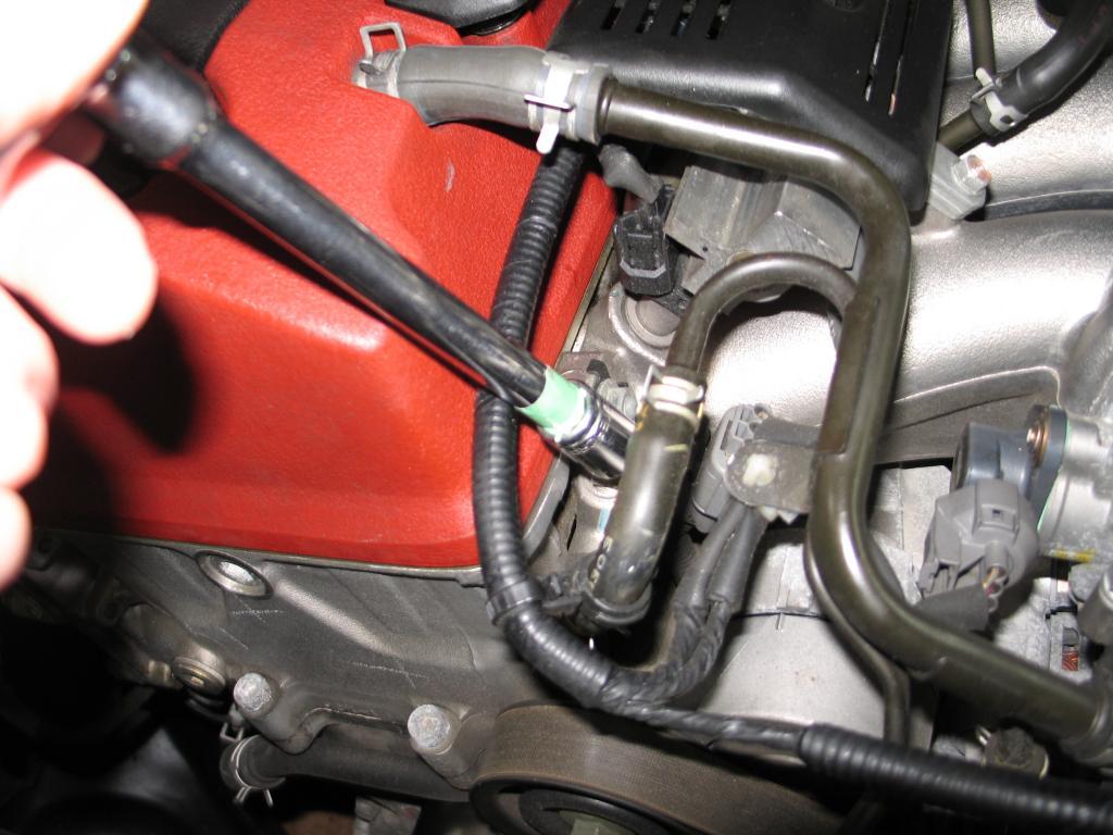 Once the coolant was trickling out, I opened the rear coolant access (its covered with a spring type hose clamp and small closed rubber nipple about an inch long) its on the firewall near the top