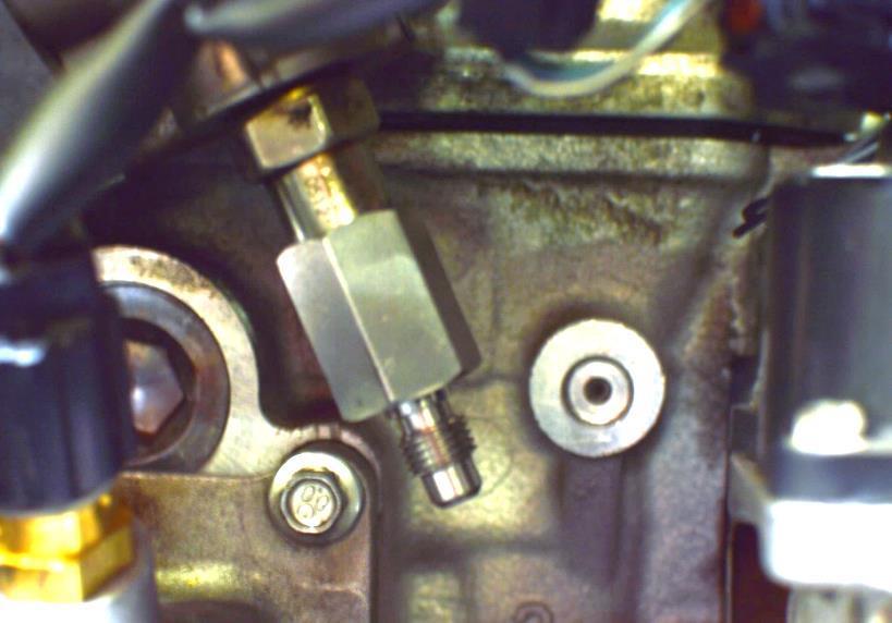 a) Install the CorkSport fuel pump fitting and fuel pump nut (shown in Figure 8a). DO NOT use thread tape or any other type of thread sealant. The threads do not provide any of the sealing.