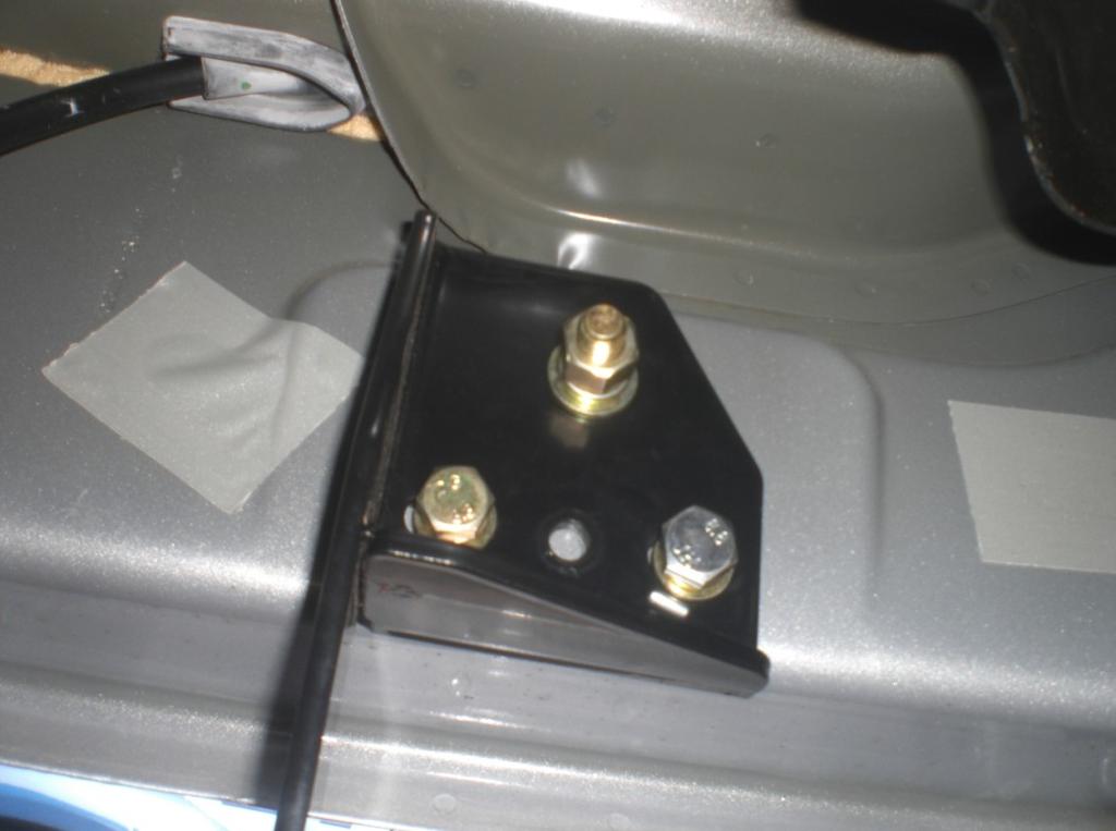 6. Attach center mounting bracket (item 4) to the rocker panel by first tightening the M8 riv-cert into place. See Fig. 6.