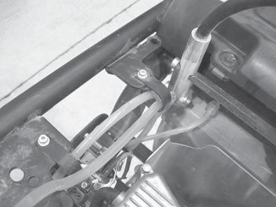 Engine and Upper Machine Components Repair Installation Perform the procedure below to install the guide handle. 4.8.1 Install the guide handle (g) to the shock mounts.