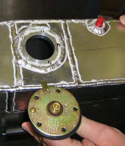 As shown in photo 1 below, the sending unit rectangular rheostat case angles upwards when properly orientated in the tank.