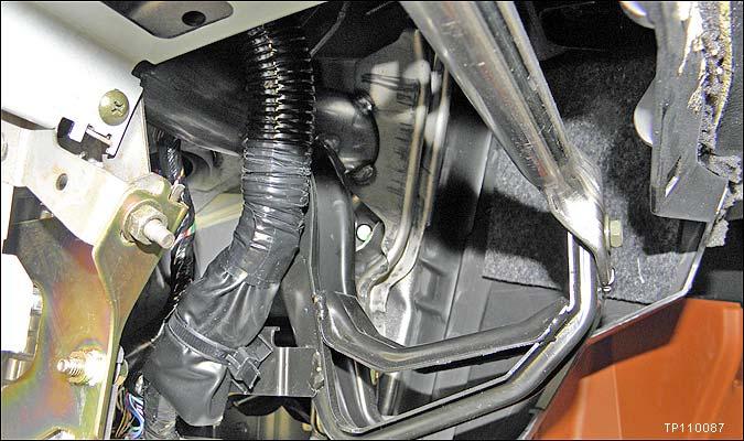 5. Remove the glove box. Refer to section IP in the Service Manual for glove box removal information. 6. Replace the lower bolt at the RH steering member (support tube) mounting point (see Figure 1).