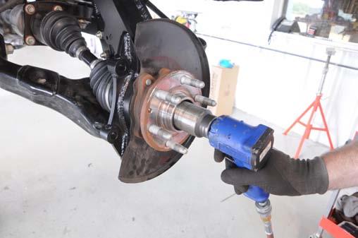 See Photo 46. Photo 45 Photo 46 Install axle nut and washer.