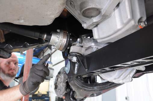 See Photo 54. Check driveshaft to exhaust clearance.