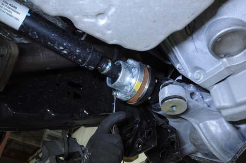 Using 21mm socket, remove the differential mounting bolts. Retain for reuse.