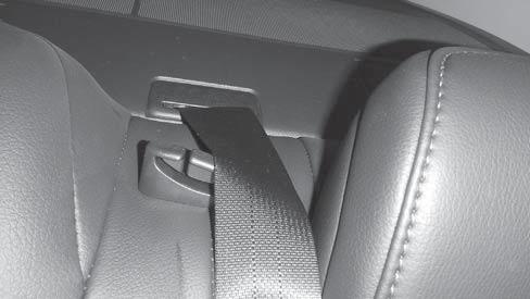 Pull up front edge of rear seat bottom cushion to release two (2) clips and