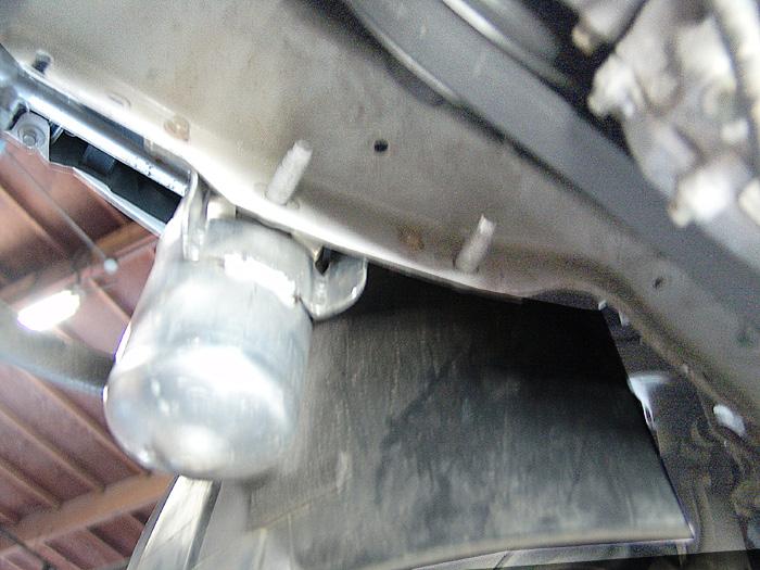 Start by removing two 10mm head bolts to remove the belt guard in the front of the motor.