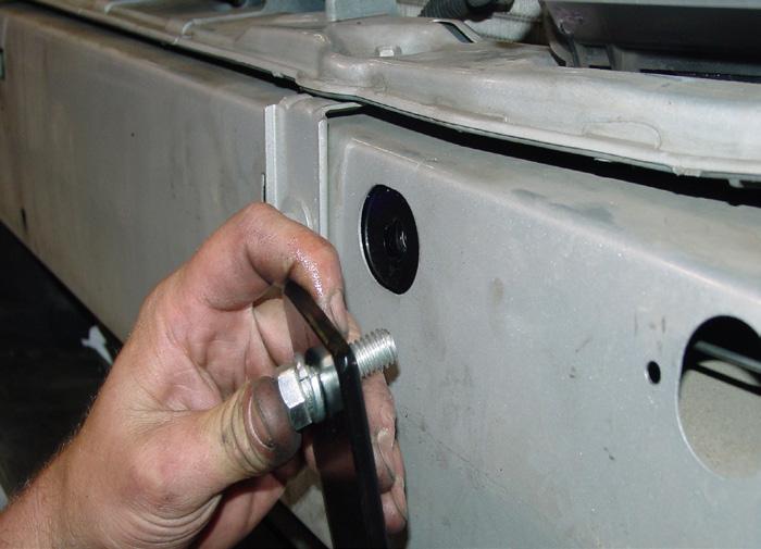 washers then hold the L-shaped upper brace over the inner mounting hole and bolt through it, the receiver