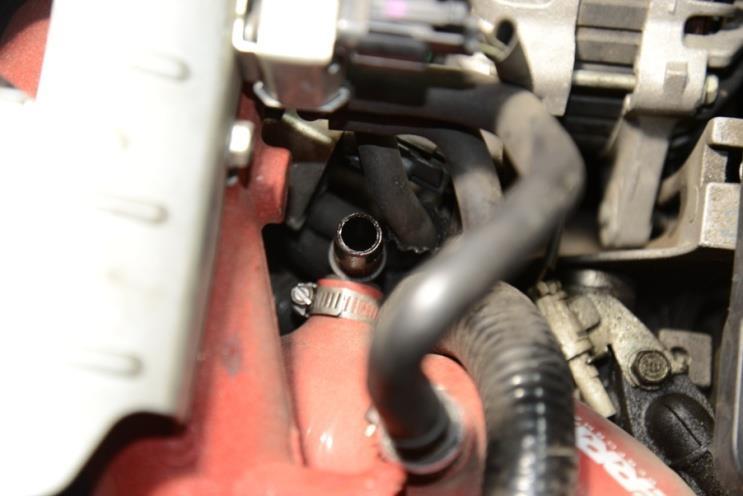 25. Remove the OEM valve cover vent hose from the air intake pipe. To attach the AOS-R side vent port to the turbo inlet pipe, measure and cut the ½ PCV hose to length.