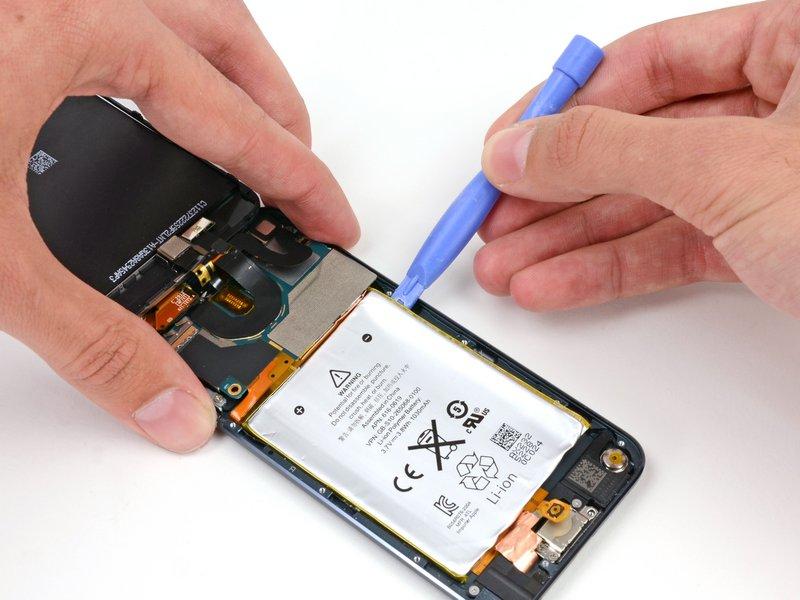 The battery is secured with large amounts of adhesive, so you'll need to go slowly and carefully to avoid puncturing or creasing the battery.