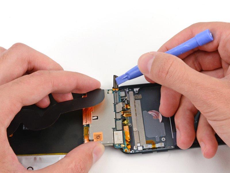 Use a plastic opening tool to disconnect the digitizer