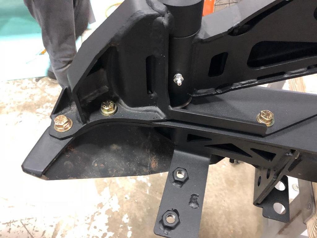 9. Take the swing arm assembly and put it on the bumper by place the pin