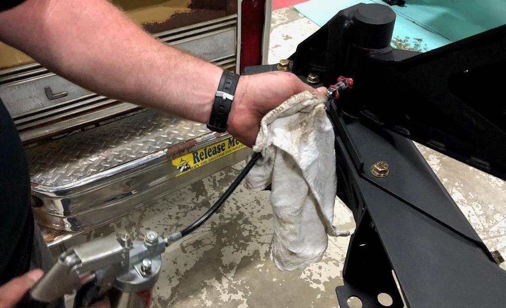 Once the swing arm is installed use a grease gun to
