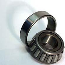 A roller bearing inner race sits on a shaft, as shown in Figure 1, while the outer race sits inside a bearing housing. The bearing housing encloses the bearing and keeps lubricant around it.