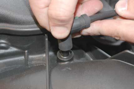 The locking tab should be removed from the fuel manifold barb and pushed back into the fi tting of the fuel line for