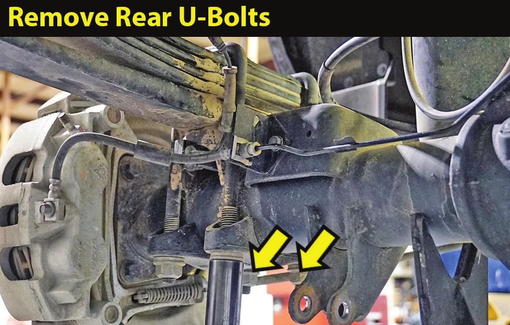 REMOVE FACTORY U-BOLTS... Illustration 27 27. [Illustration 27] With the axle well supported, remove the u-bolts and lower u-bolt plates.