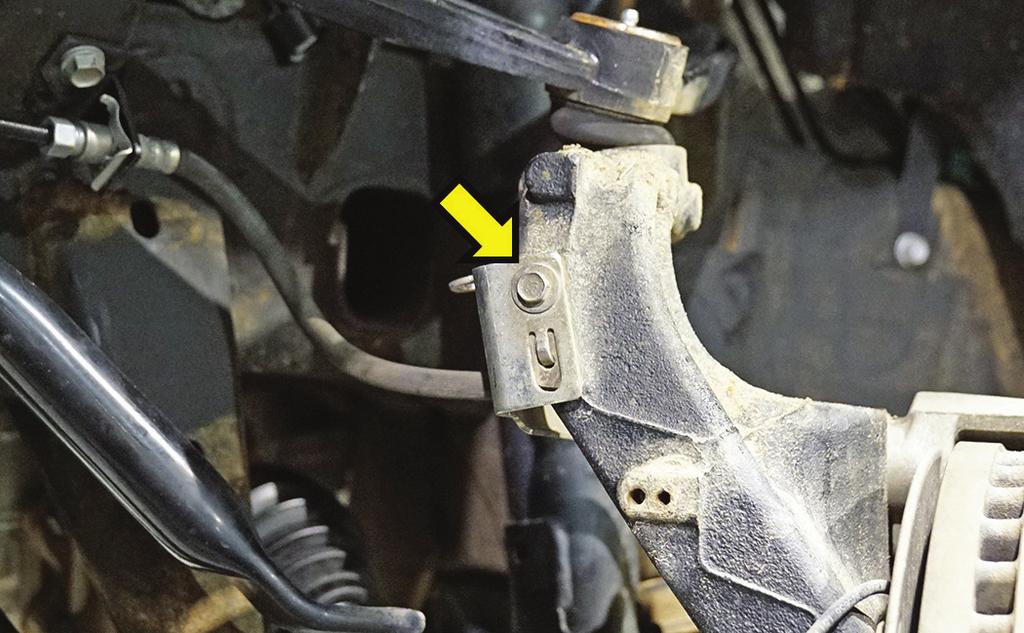 [Illustration 11] Disconnect the rubber brake hose bracket from the steering knuckle. Remove bolt and retain hardware.