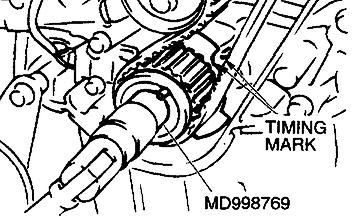 Use special tool MD998769 to turn the crankshaft 1/4 turn counterclockwise and then turn it again clockwise until the timing marks are aligned.