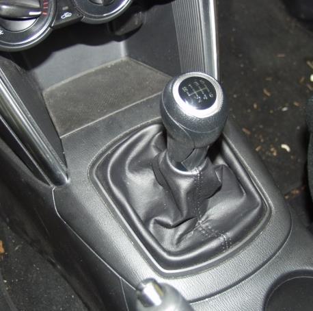 3 1. Remove the Shifter Housing a) Remove the shift knob by twisting it