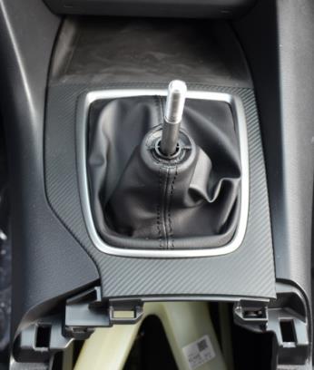 boot (Figure 1a). Figure 1a b) Remove the cup holder/parking brake panel.