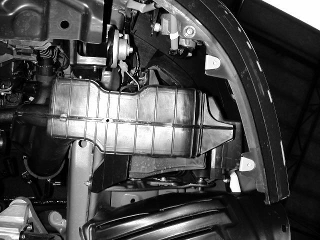 m) Remove the three bolts holding the lower resonator in behind the front