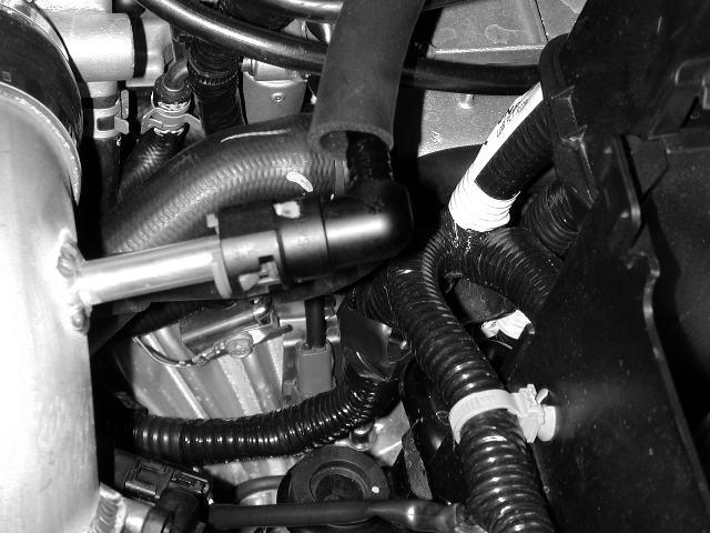 e) Slide pipe into reducing coupler on the throttle body.