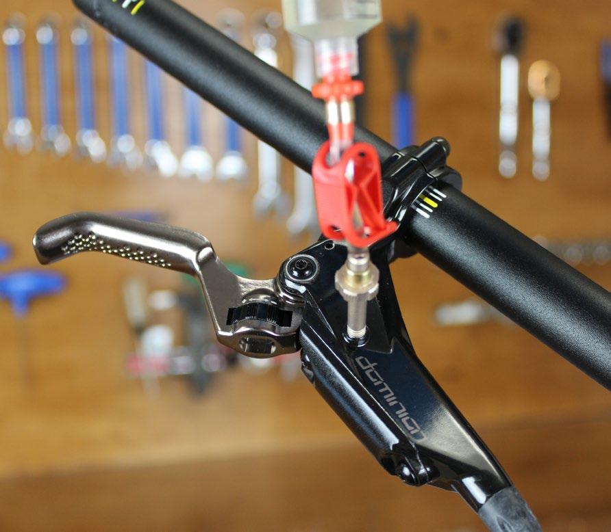Fill syringe with oil, degas, place the caliper slightly lower