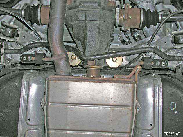 20. Remove the nuts that hold the center muffler mount brackets to the vehicle body (see Figure 16).