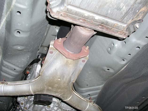 Carefully remove the exhaust center tube/rear muffler and place it in a safe location.