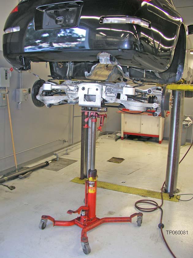 36. Carefully lower the suspension member (see Figure 34) and place it in a safe location