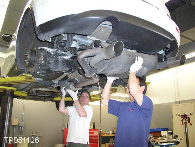 15. Carefully remove the exhaust system and place it in a safe