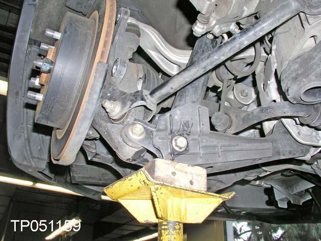 Disconnect Shock Absorber From Lower Link 25. Now place a support jack under the front lower link.