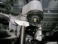 Use a support jack to raise one corner of the rear suspension assembly until the bushing assembly is flush to the body.