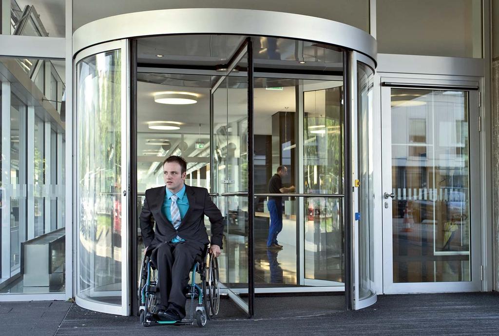 Barrier-free access at revolving doors by lateral addition of swing or sliding doors. Circular sliding doors provide versions for barrier-free access.