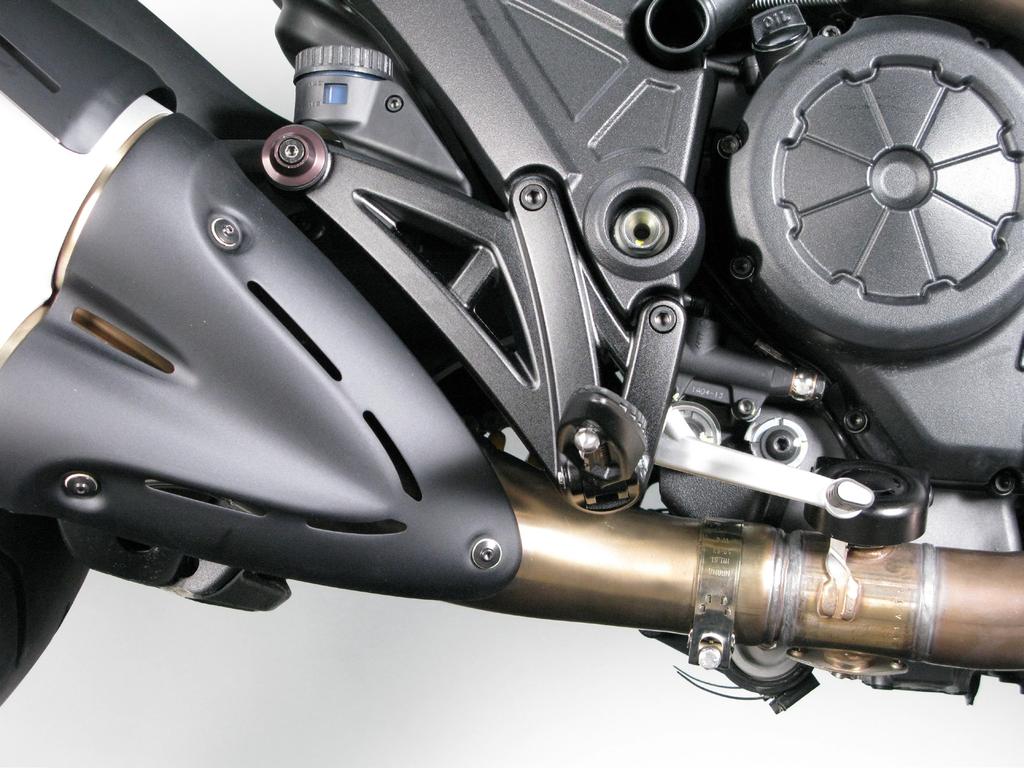 REMOVAL OF ORIGINAL EXHAUST SYSTEM: 1. 2. Put the motorcycle on a side stand, we recommend a center stand.