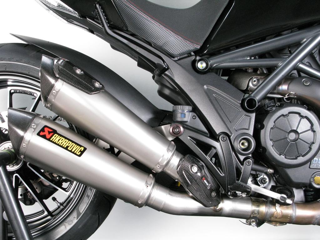 Align the mufflers in respect to the motorcycle and tighten the mufflers bracket using