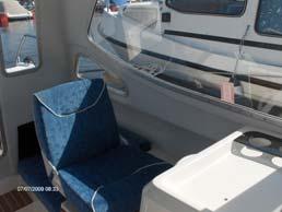 The forward facing passenger seat folds down and hinges fully forward to reveal a